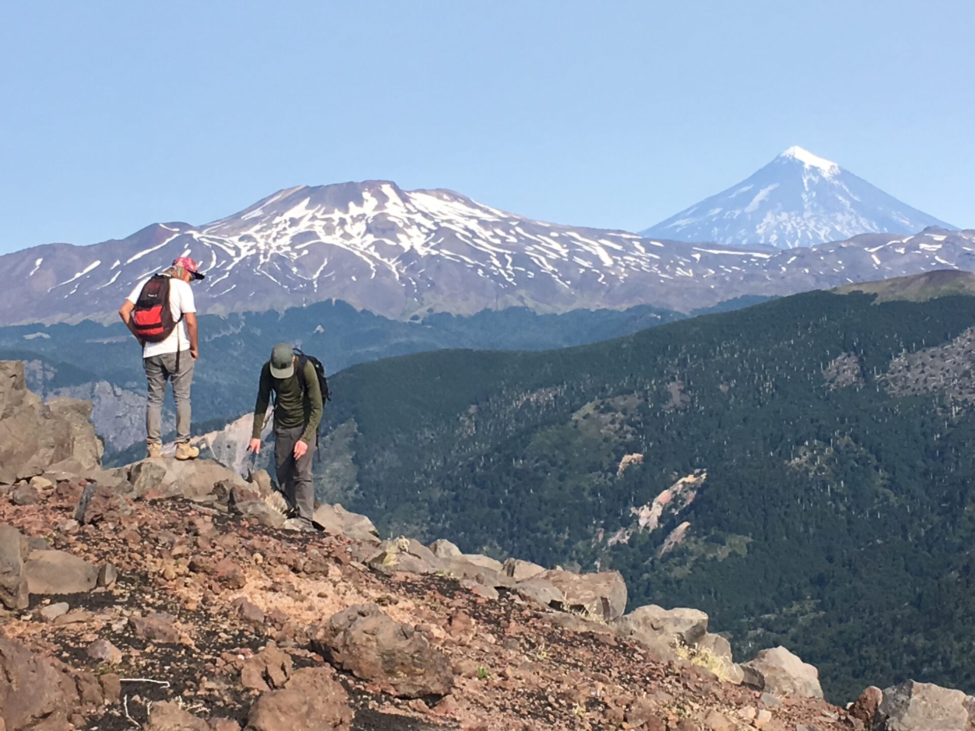 Two people near the summit of a volcano